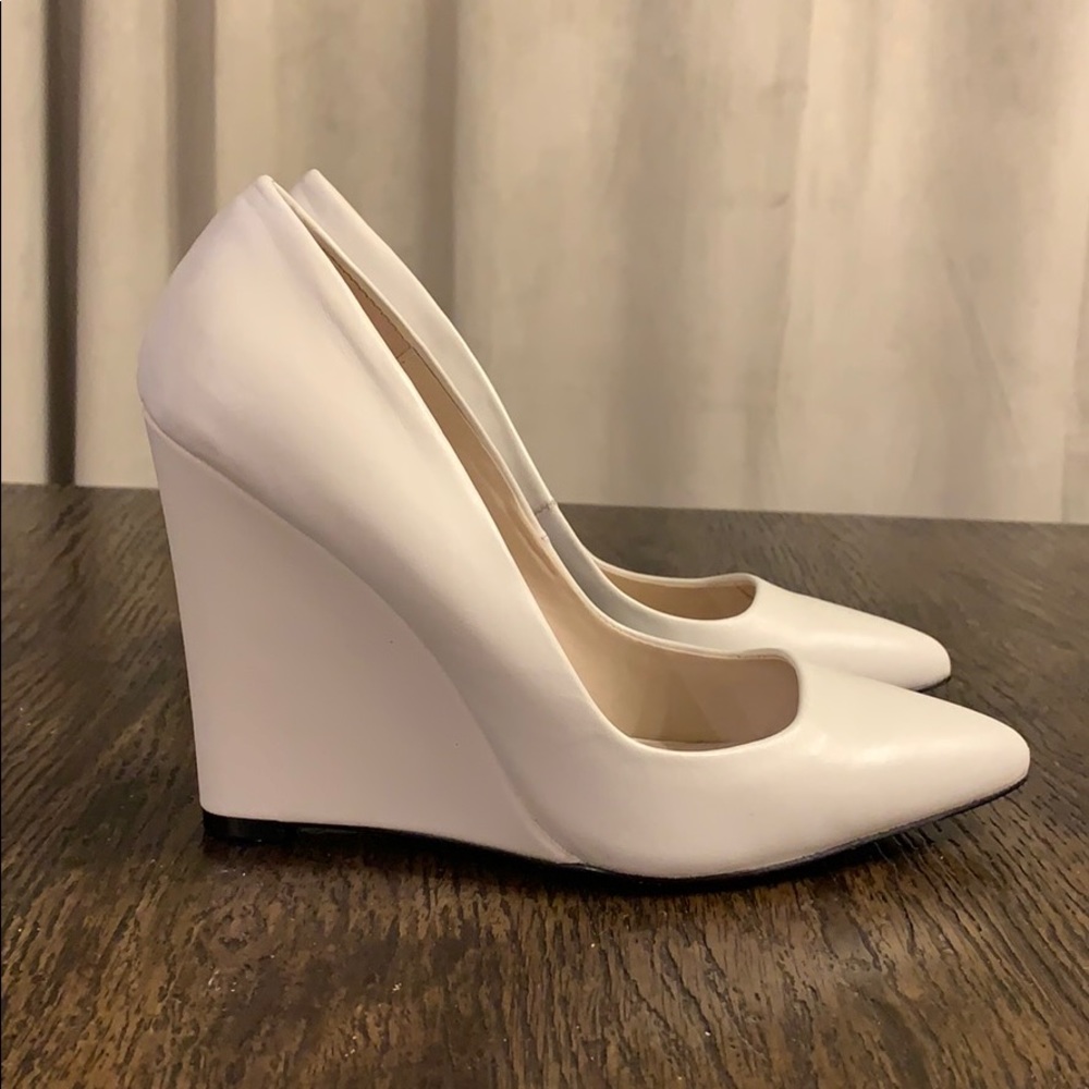 ALDO white wedge pumps